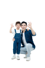 Obraz premium Full body image of Asian father and son posing on white background