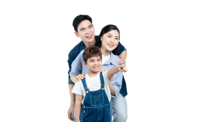 portrait of an asian family posing on a white background