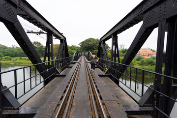 Adventurous walk on the historic train bridge riverside photography urban landscape wide shot...