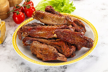 Roasted duck wings with sauce