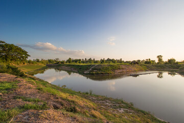 Fototapeta premium Scenic riverbank sunset rural landscape nature photography tranquil environment peaceful view serenity concept