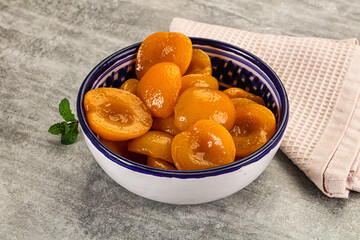 Sweet canned apricots with syrope
