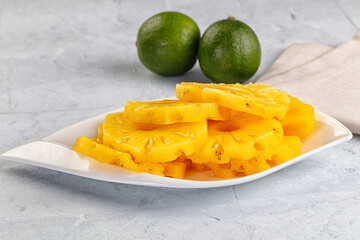 Sweet canned pineapple slices in syrope