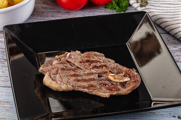 Grilled lamb steak with bone