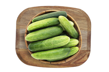 Fresh cucumbers on wooden cutting board