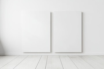 Two blank canvases mounted on a white wall, against a light wooden floor