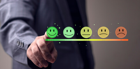 Customer service satisfaction concept. Businessman is pressing smiley emoticon on virtual touch screen. Customer service evaluation concept. Service, Concept, Reputation, Happy, Survey.