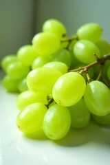 Set of juicy green grapes neatly lined up on a clean white surface, vibrant, grapes, round