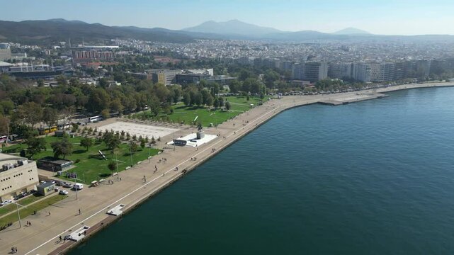 Thessaloniki Waterfront And Nea Paralia Park Greece Sunny Morning Drone Shot Over Ocean 4K 60FPS