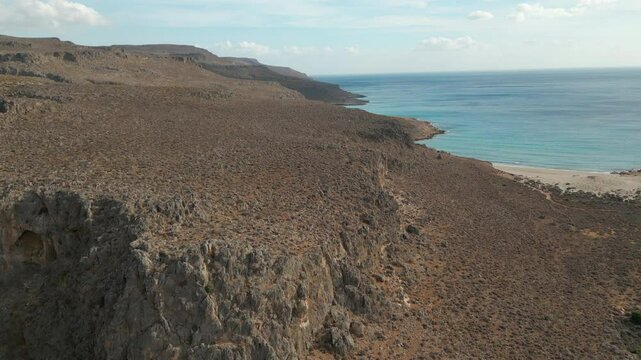 Rocky Canyon And Pristine Blue Coastline Zakros Crete Greece Drone Track In 4K 60FPS