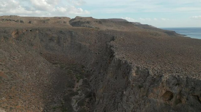 Olive Trees Rocky Hills And Blue Ocean Zakros Crete Greece 4K 60FPS
