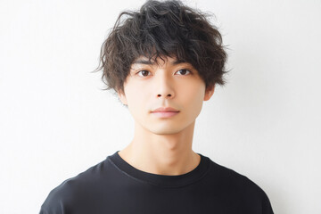 close up of young handsome man standing on white background