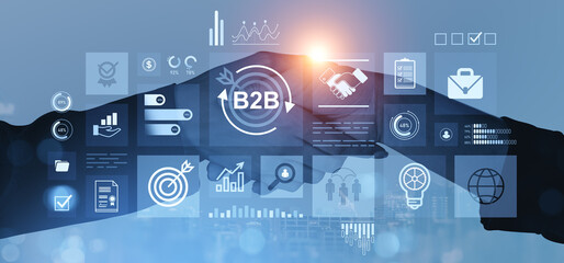 B2B business handshake with digital interface and data icons on blue background.