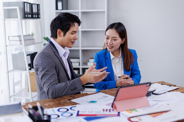 Team of Accounting business are calculating income-expenditure and analyzing real estate investment data on tablet computer, Financial and tax systems concept.
