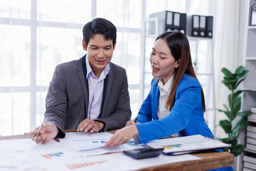 Team of Accounting business are calculating income-expenditure and analyzing real estate investment data on tablet computer, Financial and tax systems concept.
