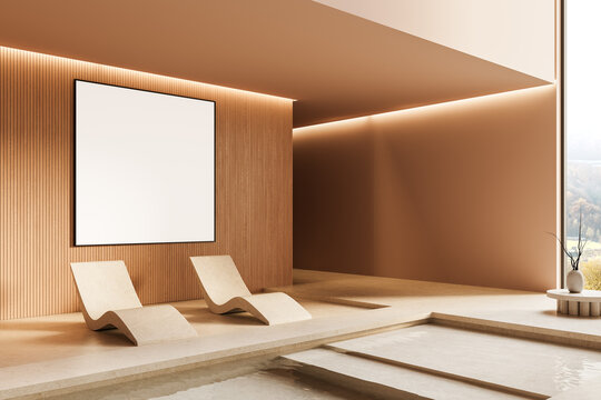 Blank poster mockup on wooden wall in minimal spa interior with two lounge chairs and indoor pool, large window lighting the serene space. 3D Rendering