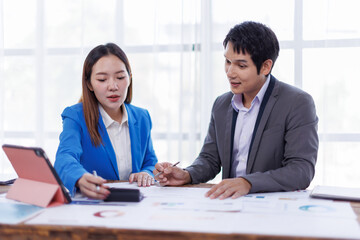 Business finance accounting banking concept. Business hand doing finances and calculate on desk about cost at office. Two Business working on desk with using calculator, finance accounting.