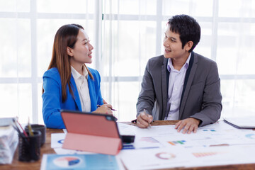 Business finance accounting banking concept. Business hand doing finances and calculate on desk about cost at office. Two Business working on desk with using calculator, finance accounting.