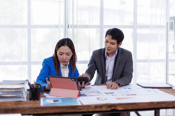 Business finance accounting banking concept. Business hand doing finances and calculate on desk about cost at office. Two Business working on desk with using calculator, finance accounting.