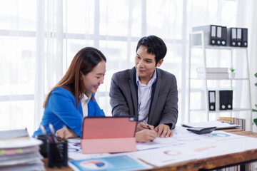 Business finance accounting banking concept. Business hand doing finances and calculate on desk about cost at office. Two Business working on desk with using calculator, finance accounting.