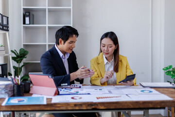 Business finance accounting banking concept. Business hand doing finances and calculate on desk about cost at office. Two Business working on desk with using calculator, finance accounting.