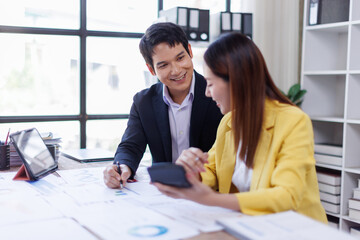Business finance accounting banking concept. Business hand doing finances and calculate on desk about cost at office. Two Business working on desk with using calculator, finance accounting.