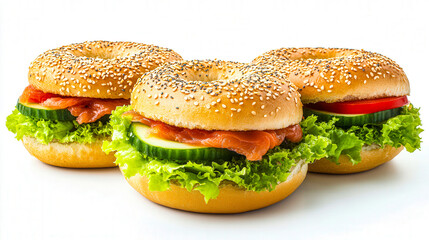 Three bagels with salmon cucumber and lettuce food isolated on a white background