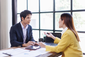 Team of Business people advisor, business people talking, planning analyze investment and marketing on tablet in office.
