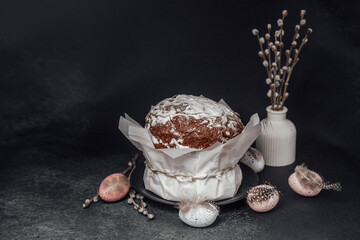 Easter still life with festive cake and painted eggs. Rustic spring holiday table setup with natural decor..