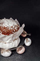 Easter still life with festive cake and painted eggs. Rustic spring holiday table setup with natural decor..