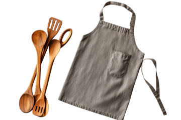 Rustic wooden spoons and spatula set with a stylish grey apron against a stark black on transparent background