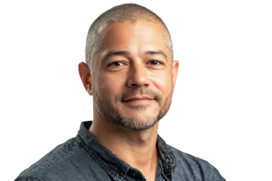 Serene middle aged man with short gray hair and a subtle smile against a black background on transparent background
