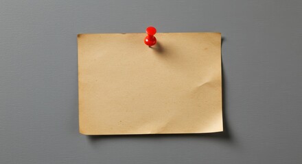 Blank vintage brown paper note pinned to gray wall, suitable for advertisements, announcements, reminders, or as a background for quotes or text overlays.