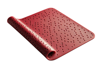 Red perforated rubber mat rolled up on black background showcasing texture and design details on transparent background