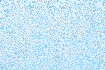 Soda water with bubbles as background, closeup