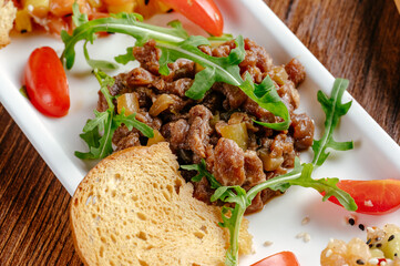 A girl smiles on a white background