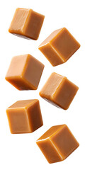 Caramel cubes in motion isolated on transparent background