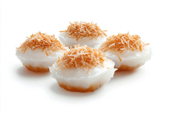 a group of four desserts with coconut toppings