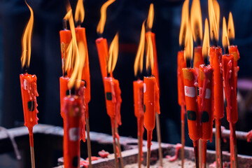 Burning red candles at man mo temple in hong kong