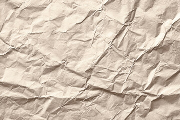 Fototapeta premium Crumpled paper, texture and subtle grid lines fill frame, creating visually intriguing background. paper almost seems to whisper secrets of ages past