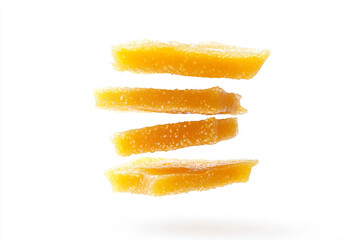 a stack of orange peels on a white surface