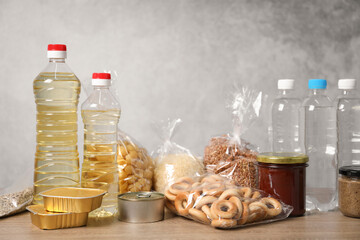 Many different food products on wooden table