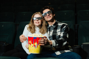 Couples enjoying movie night with popcorn in a theater setting