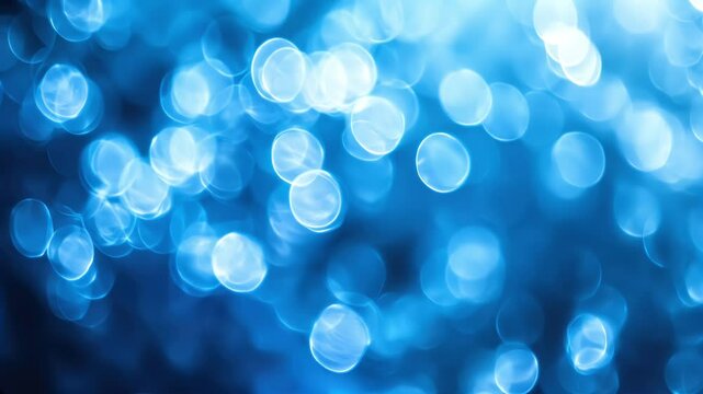 blue bokeh light particles glittering softly in vibrant defocused background