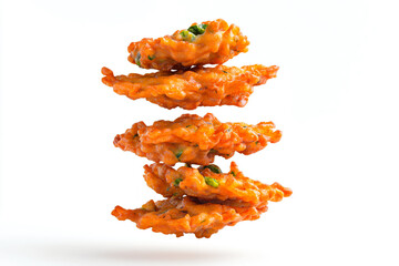 a stack of fried food on a white surface
