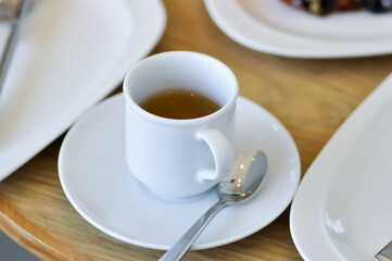 hot tea , tea cup and bakery