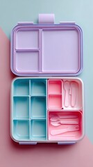 Pastel bento box with compartments and cutlery. Perfect for packing healthy and delicious meals for kids or adults.