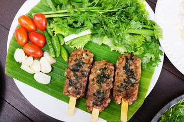 Grilled pork with vegetable on banana leaf. Tradition food of Thailand