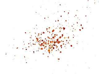 Dried red chili powder flying. Grainy scatterings of spicy burst . Splashes of red pepper powder.Overlay effect chilli or paprika spice splatters.