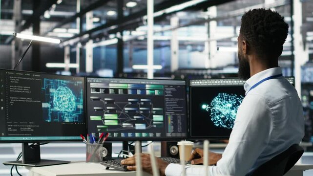 Data center programmer uses machine learning node tree program to identify equipment issues. Server hub worker reviewing artificial intelligence data analysis graph to minimize failures, camera B